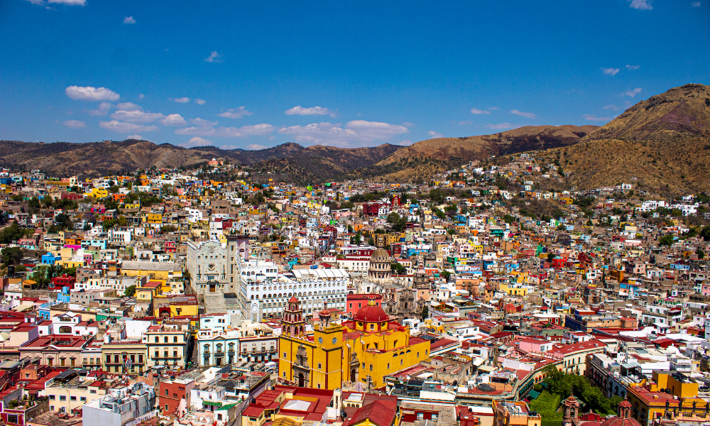 aerial view of mexican town nestled in the mountains